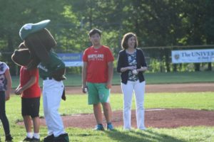 Volunteer Stephen Jin and Executive Director Lori Marks throw out the first pitch.