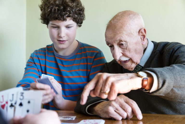 linkgenerations.com-boy-and-elder-playing-cards