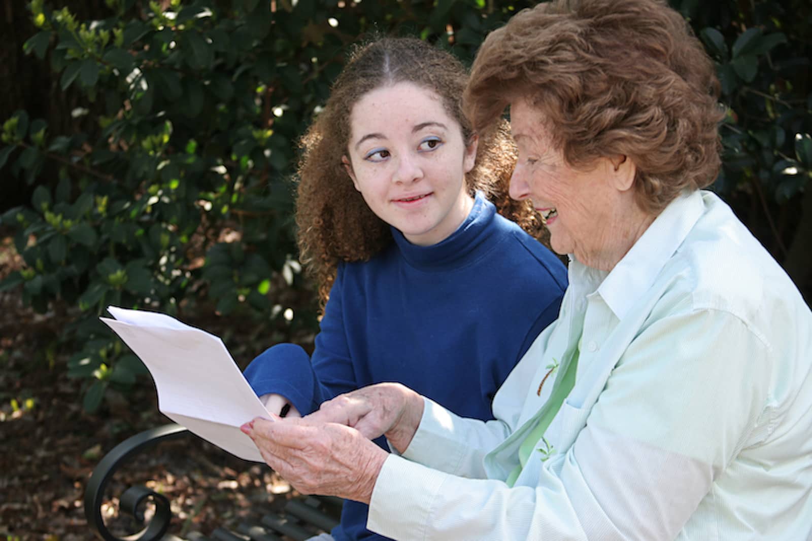 teen-reading-with-senior-citizen